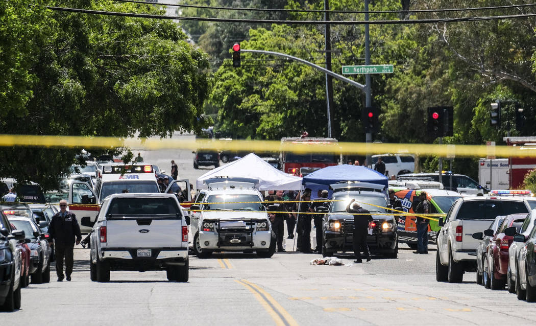 Police officers investigate outside North Park School after a fatal shooting at the elementary school, Monday, April 10, 2017, in San Bernardino, Calif. (Ringo H.W. Chiu/AP)