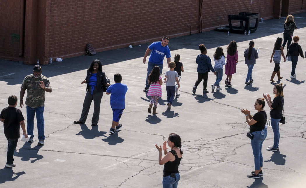 Police on Friday, April 14, released portions of the 911 calls from the shooting that left a teacher and student dead. (Ringo H.W. Chiu/AP)
