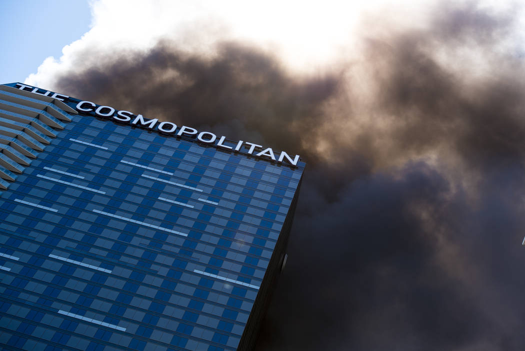 Smoke billows from a fire at the pool of The Cosmopolitan hotel-casino on the strip in Las Vegas on Saturday, July 25, 2015. Joshua Dahl Las Vegas Review-Journal