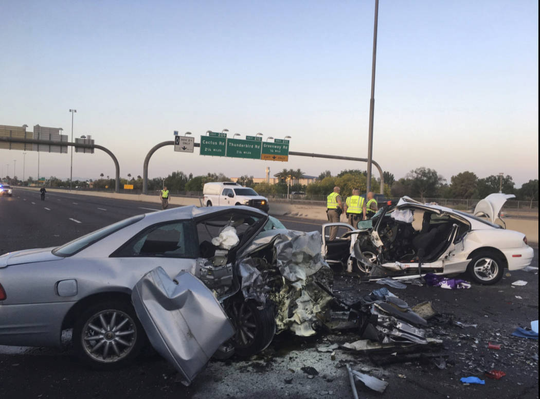 The mangled remains of cars involved in a fatal accident on the Northbound Interstate 17 in Phoenix, Ariz. on Friday, April 14, 2017. (Arizona Department of Public Safety via AP)
