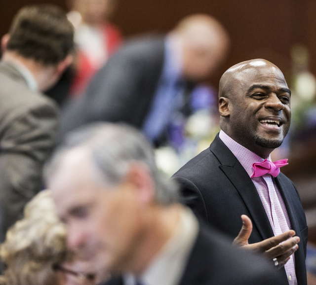 Sen. Kelvin Atkinson, D-North Las Vegas, interacts with colleagues in the Senate Chambers during the third day of the Nevada Legislative session on Wednesday, Feb. 8, 2017, at the Legislative Buil ...