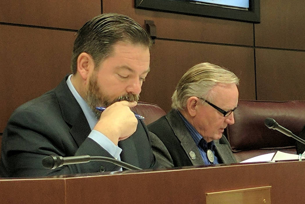 State senators Michael Roberson, left, and Don Gustavson, read a bill during a judiciary committee hearing Friday in Carson City. Dozens of bills had to pass a committee vote or get an exemption t ...