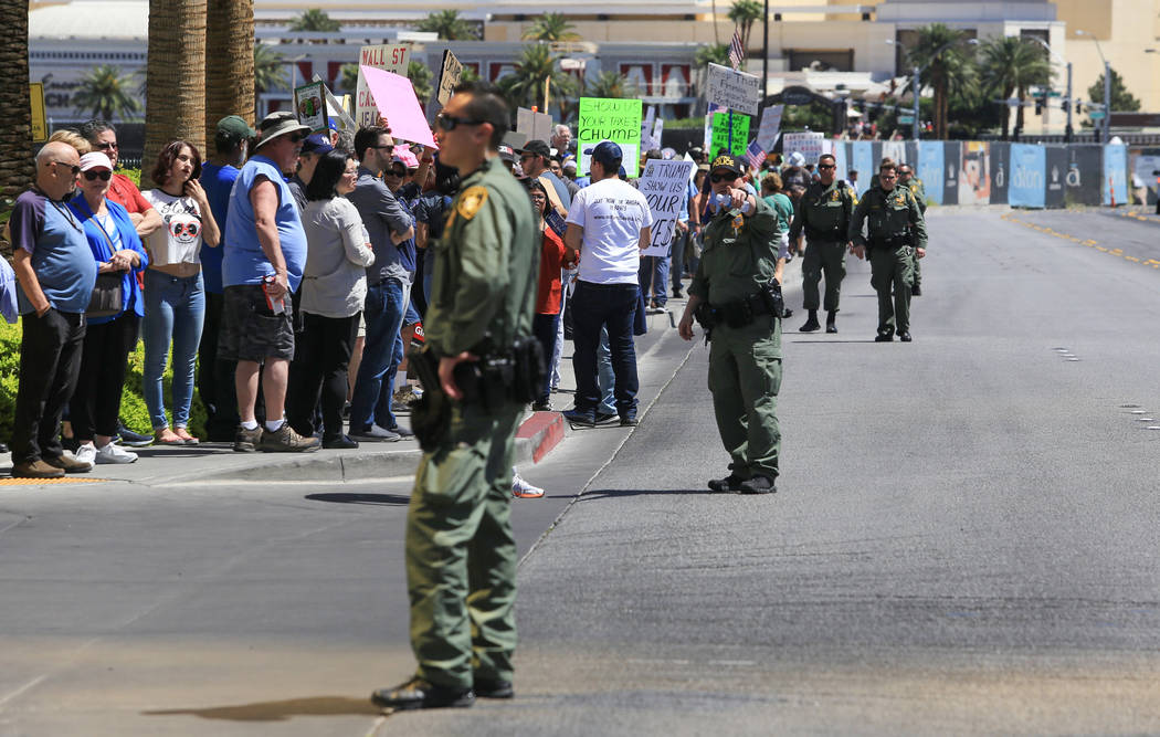 Las Vegas police keep demonstrators off of Fashion Show Drive during a tax day protest at Trump International Hotel on Saturday, April 15, 2017. Brett Le Blanc Las Vegas Review-Journal @bleblancphoto