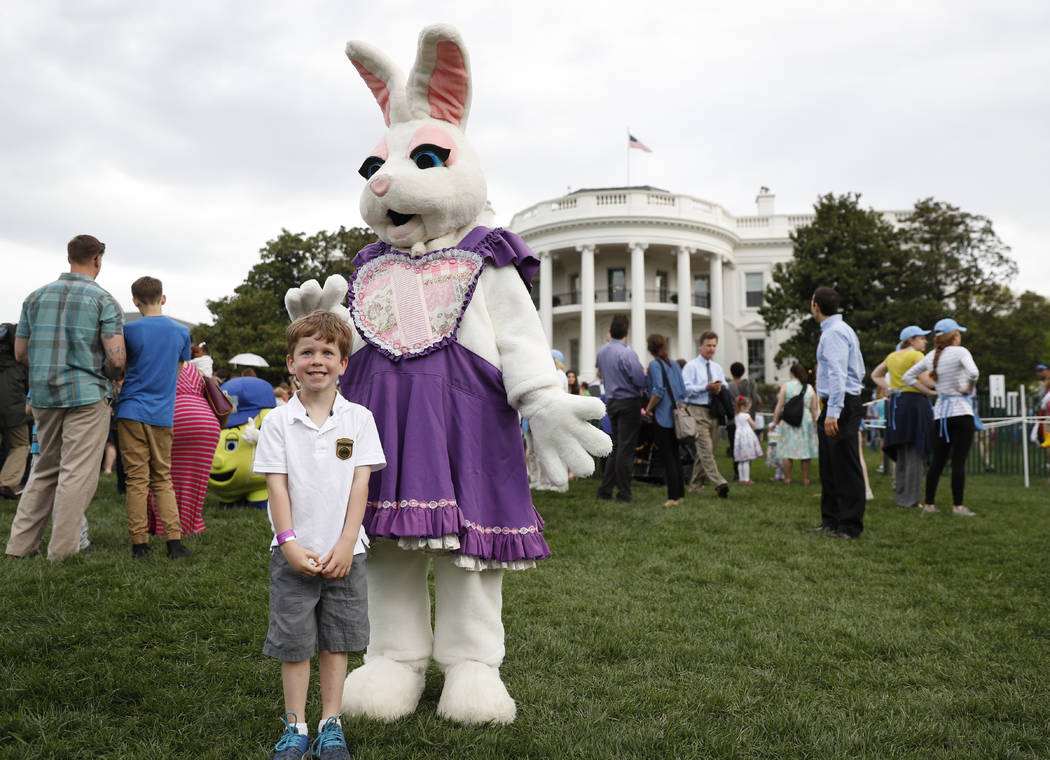 Michael McGee, 5, poses with an Easter bunny during the White House Easter Egg Roll on the South Lawn of the White House in Washington, Monday, April, 17, 2017. (Carolyn Kaster/AP)