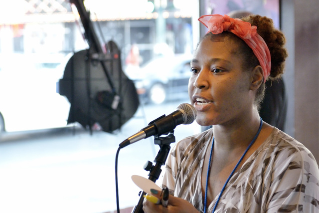 Organizer Vogue Robinson makes an announcement during a poetry slam sponsored by the Battle Born slam poetry team at The Beat Coffeehouse and Records at 520 Fremont St. in Las Vegas on Friday, Jul ...