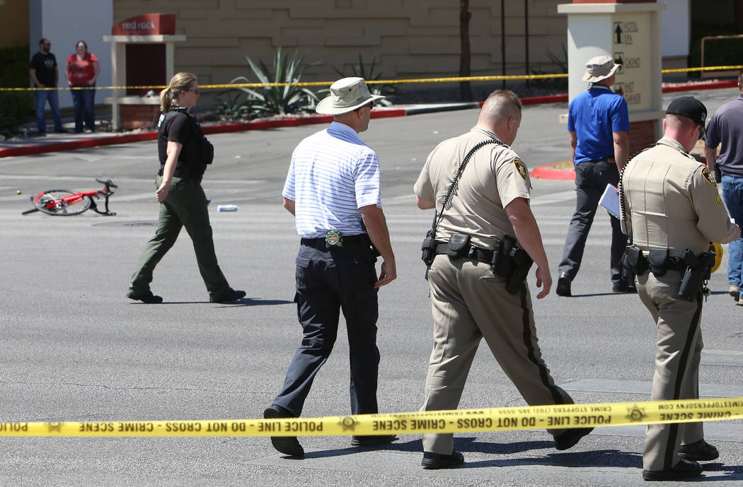Las Vegas police investigate a fatal crash that left a bicyclist dead in the western Las Vegas Valley, near Red Rock Station, on Tuesday, April 18, 2017, in Las Vegas. Bizuayehu Tesfaye Las Vegas  ...