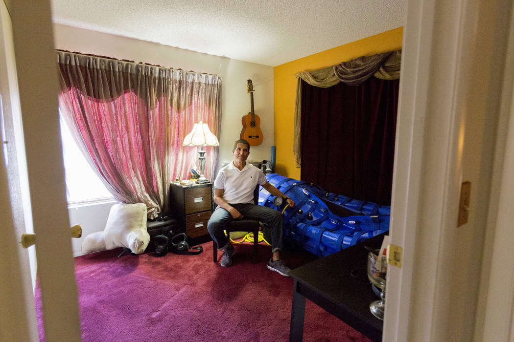 Author and former Air Force major Anthony Jones who suffers from major brain injuries from Iraq, is next to his hyperbaric oxygen chamber in his home in Las Vegas, Wednesday, April 19, 2017. Eliza ...