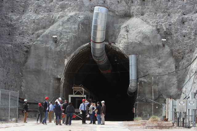 Congressional staff members, media and Department of Energy employees wait for congressmen to emerge from the north portal during a congressional tour of the Yucca Mountain exploratory tunnel Thur ...