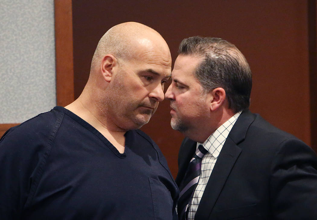 Las Vegas Fire captain Richard Loughry, left, appears with his attorney Craig Hendricks at the Regional Justice Center on Thursday, April 20, 2017, in Las Vegas. Loughry is accused of paying a 15- ...