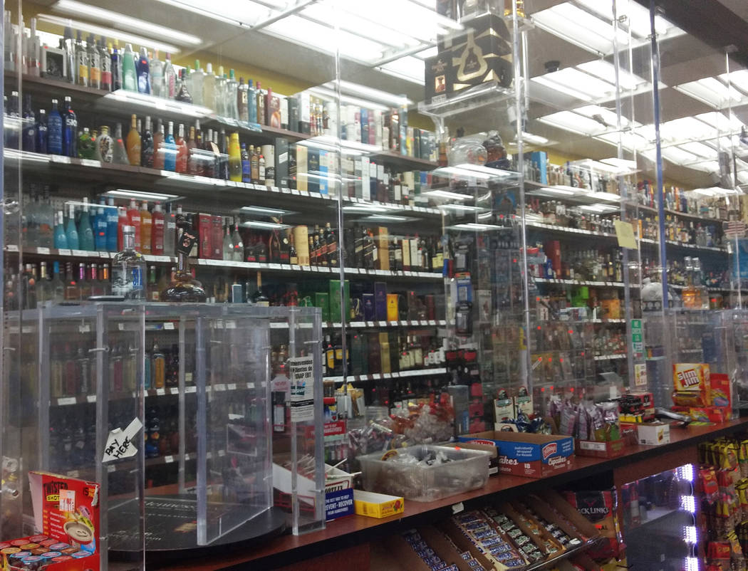 A liquor store and market on Nellis Boulevard offers a wide assortment of pottled liquor on display behind bullet proof glass. (F. Andrew Taylor/View) @ FAndrewTPress