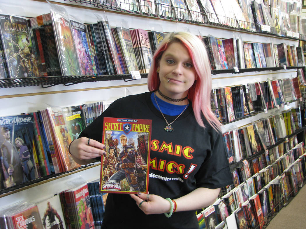 Julia Rudolph  who handles customer service and sales for Cosmic Comics, 3830 E. Flamingo Road holds up, Marvel’s “Secret Empire,” one of the fifty different titles that retai ...