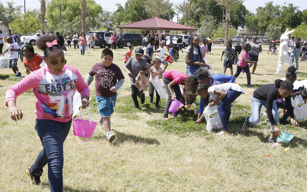 Children, including Tiphanie Bates, left, participate in the annual Easter egg hunt event at Doolittle Community Field on Tuesday, April 10, 2017, in Las Vegas. (Bizuayehu Tesfaye/Las Vegas Review ...