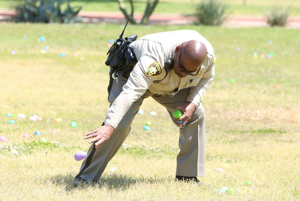 Metro police officer Charles Jenkins hides eggs during the annual Easter egg hunt event at Doolittle Community Field on Tuesday, April 10, 2017, in Las Vegas. Bizuayehu Tesfaye Las Vegas Review-Jo ...