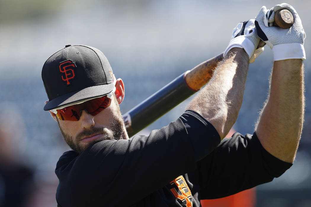 San Francisco Giants' Mac Williamson warms up prior to a spring training baseball game against the Milwaukee Brewers Sunday, March 19, 2017, in Scottsdale, Ariz. (AP Photo/Ross D. Franklin)