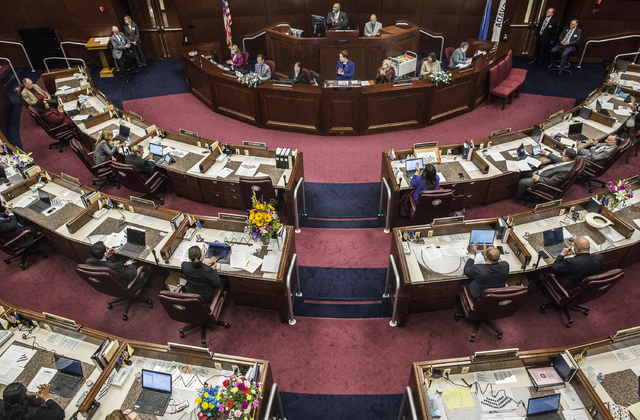 Assembly Speaker Jason Frierson, top/middle, leads applause for a fellow assemblymen's family member during the second day of the Nevada Legislative session on Tuesday, Feb. 7, 2017, at the Legisl ...
