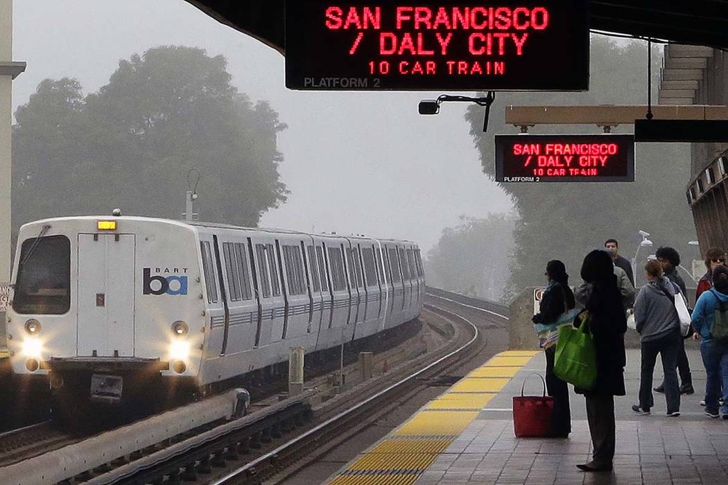 Bay Area Rapid Transit passengers wait for a train in Oakland, California, in a file photo. (Ben Margot/AP)
