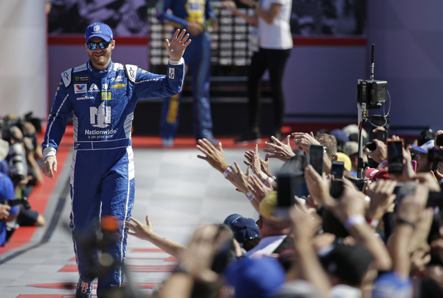 Dale Earnhardt Jr. greets fans before the NASCAR Daytona 500 auto race at Daytona International Speedway in Daytona Beach, Fla., Sunday, Feb. 26, 2017. John Raoux AP