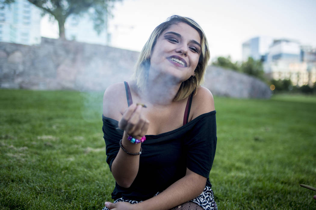 Sabrina Marquez, 17, a Las Vegas native, smokes a joint in Commons Park in Denver Colorado, Friday, Sept. 2, 2016.  Elizabeth Page Brumley Las Vegas Review-Journal Follow @ELIPAGEPHOTO