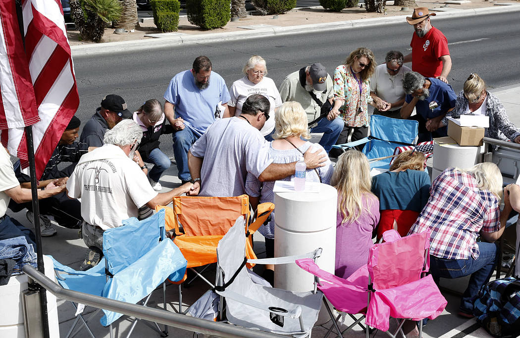 Supporters pray outside the Lloyd George U.S. Courthouse while awaiting the jury's verdict in the first Bunkerville standoff trial on Monday, April 24, 2017, in Las Vegas. Bizuayehu Tesfaye Las Ve ...