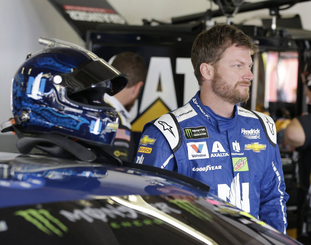 Dale Earnhardt Jr. in his garage during a NASCAR auto racing practice session at Daytona International Speedway, Friday, Feb. 24, 2017, in Daytona Beach, Fla. (AP Photo/John Raoux)