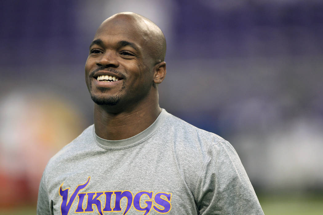 In this Dec. 18, 2016, file photo, Minnesota Vikings running back Adrian Peterson warms up before the start of an NFL football game against the Indianapolis Colts, in Minneapolis. Free-agent runni ...