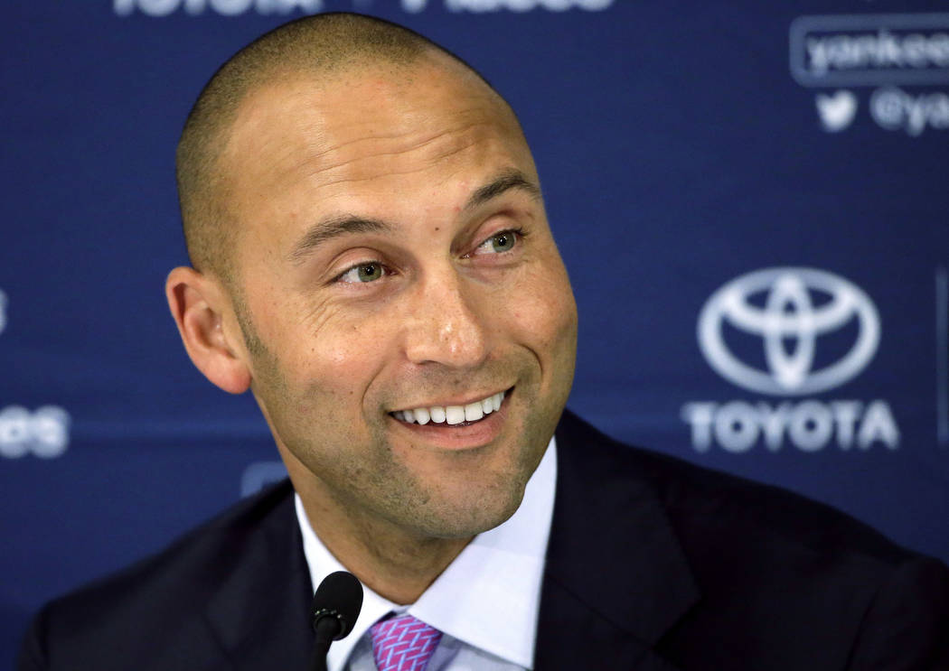 In this Sept. 28, 2014, file photo, New York Yankees' Derek Jeter speaks to the media after the last baseball game of his career, against the Boston Red Sox, at Fenway Park in Boston. (AP Photo/St ...