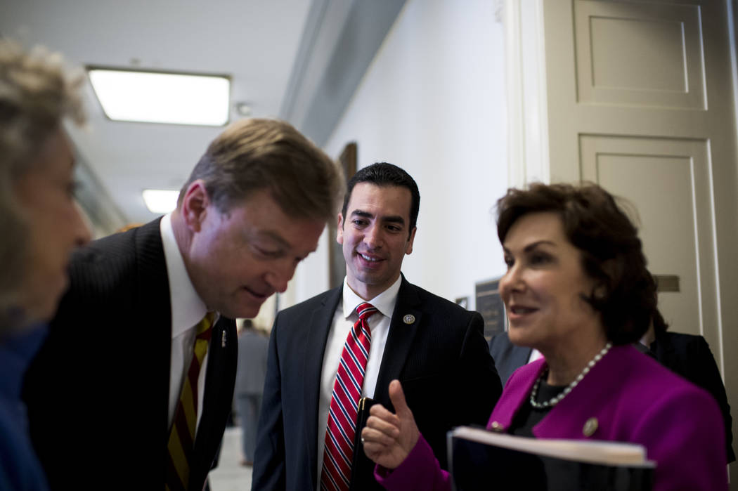 Rep. Ruben Kihuen, D-Nev., center, meets with Sen. Dean Heller, R-Nev., and Rep. Jacky Rosen, D-Nev., after making statements in opposition to using Yucca Mountain as a nuclear waste disposal site ...
