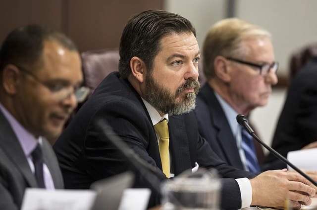 Senate Minority Leader Michael Roberson, R-Nev., listens to a colleague speak during the Senate Revenue and Economic Development meeting on the second day of the Nevada Legislative session on Tues ...