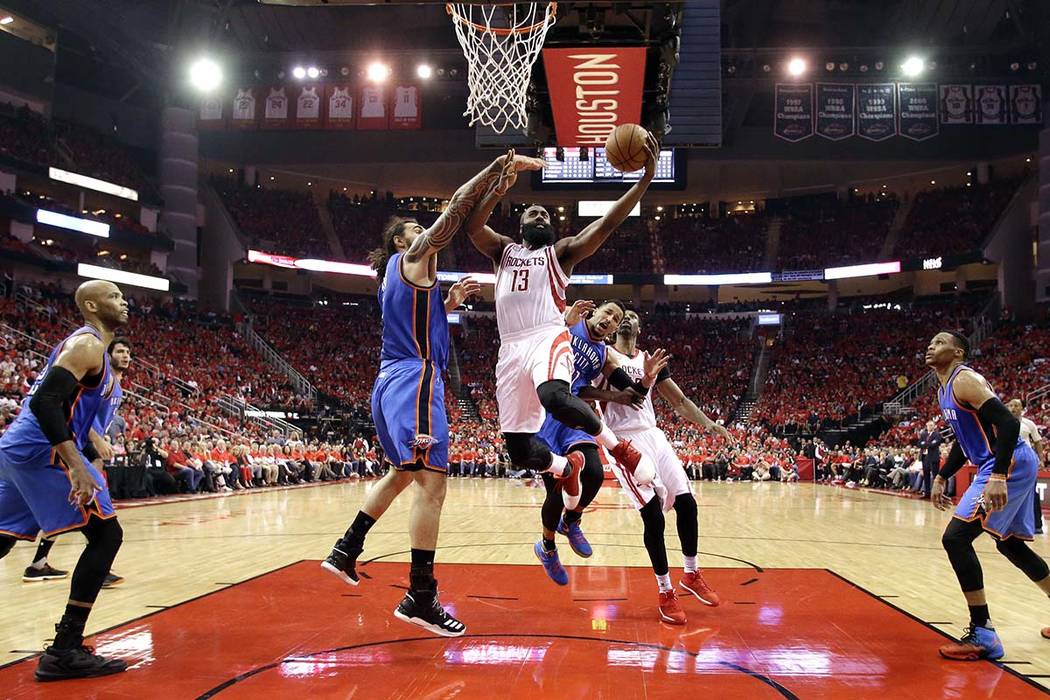 Houston Rockets' James Harden (13) goes up for a shot as Oklahoma City Thunder's Steven Adams defends during the second half in Game 5 of an NBA basketball first-round playoff series, Tuesday, Apr ...