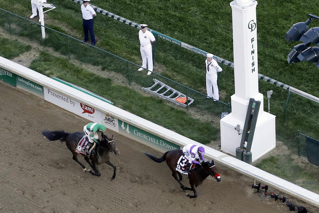 In this May 7, 2016, file photo, jockey Mario Gutierrez rides Nyquist to victory ahead of Exaggerator, ridden by Kent Desormeaux, in the 142nd running of the Kentucky Derby horse race at Churchill ...