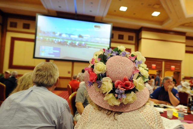 A women watches the Kentucky Derby during a viewing party inside the grand ballroom at the South Point Casino and Hotel in Las Vegas Saturday May 03, 2015.(Josh Holmberg/Las Vegas Review Journal)