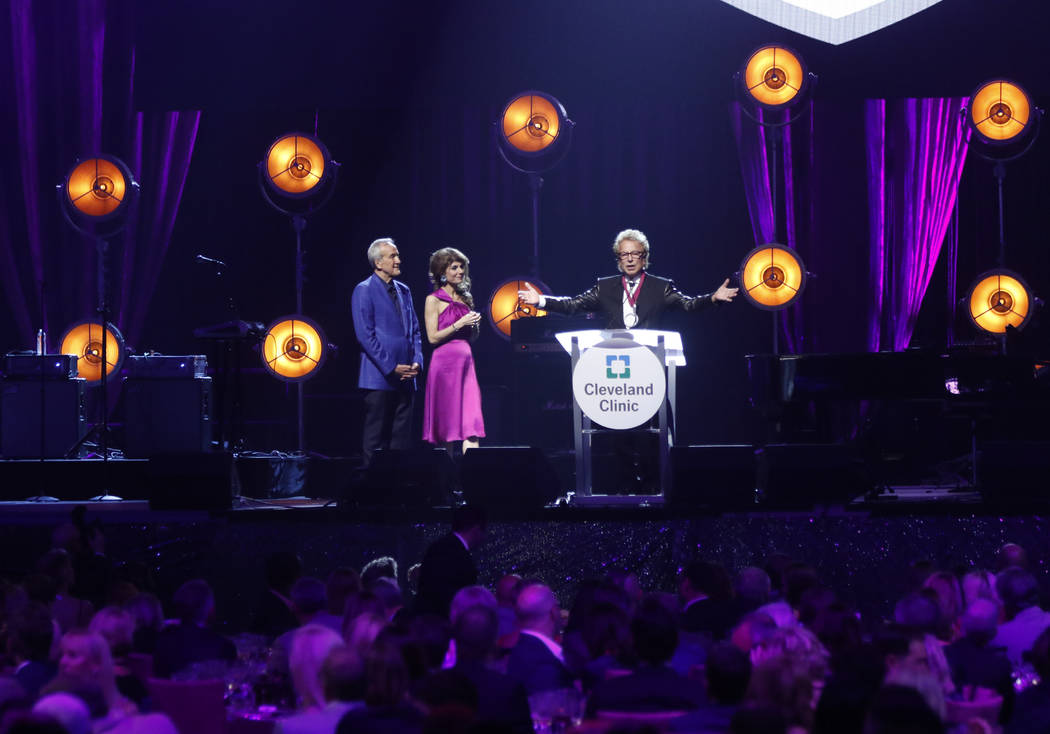 Inaugural Caregiver Award recipient Siegfried Fischbacher, right, speaks alongside Larry and Camille Ruvo during Keep Memory Alive's 21st annual Power of Love gala, raising money for Cleveland Cli ...