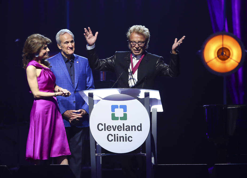 Inaugural Caregiver Award recipient Siegfried Fischbacher, right, speaks alongside Larry and Camille Ruvo during Keep Memory Alive's 21st annual Power of Love gala, raising money for Cleveland Cli ...