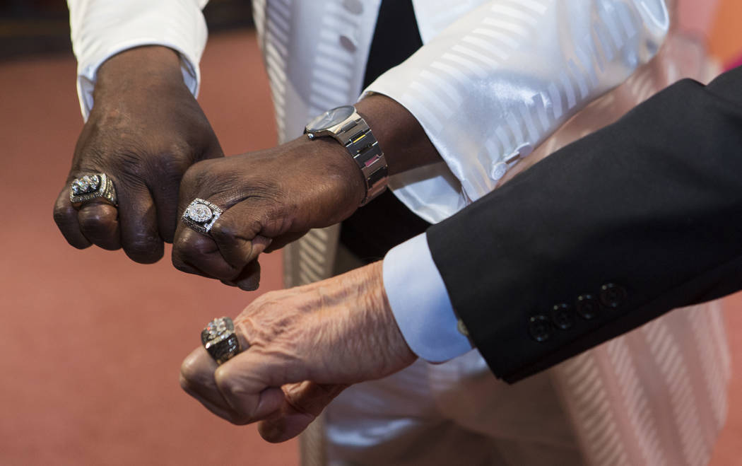 Former Oakland Raiders players Lester Hayes, left, and former Raiders head coach Tom Flores show off their rings before Keep Memory Alive's 21st annual Power of Love gala, raising money for Clevel ...