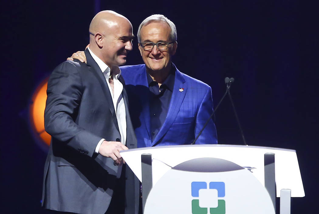 Larry Ruvo, co-founder of Keep Memory Alive, right, welcomes tennis legend Andre Agassi during Keep Memory Alive's 21st annual Power of Love gala at the MGM Grand Garden Arena in Henderson on Thur ...
