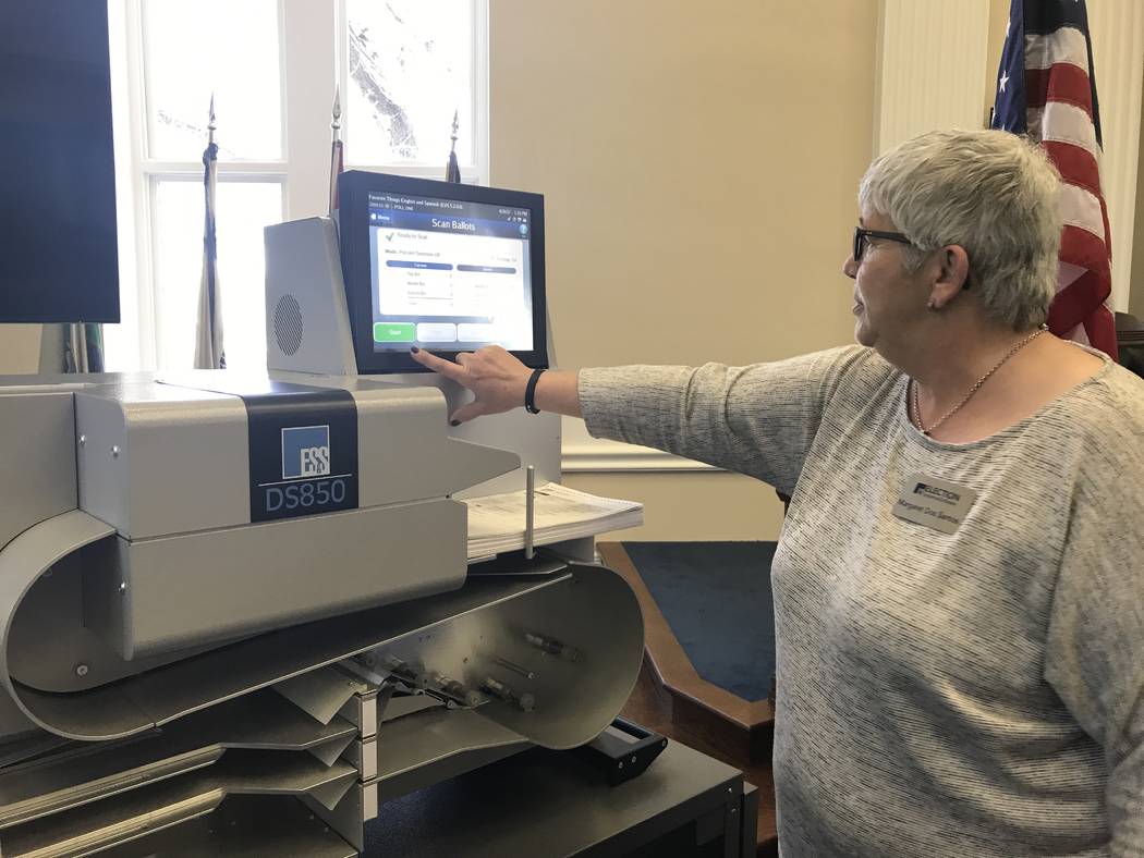 Margaret Dos Santos, with Election Systems & Software, demonstrated a high-speed ballot scanner Wednesday, April 26, 2017 at the state Capitol in Carson City. Sandra Chereb/Las Vegas Review-Jo ...