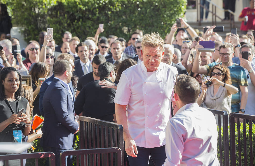 Gordon Ramsey walks onto stage before the start of a press conference to announce his new restaurant Gordon Ramsay Hell's Kitchen, which will be located at the current Stripside Cafe (formerly Ser ...