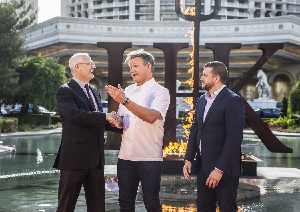 Caesars Palace president Gary Selesner, left, shakes hands with celebrity chef Gordon Ramsey and ITV America's Ed Simpson during a press conference to announce Ramsey's new restaurant Gordon Ramsa ...