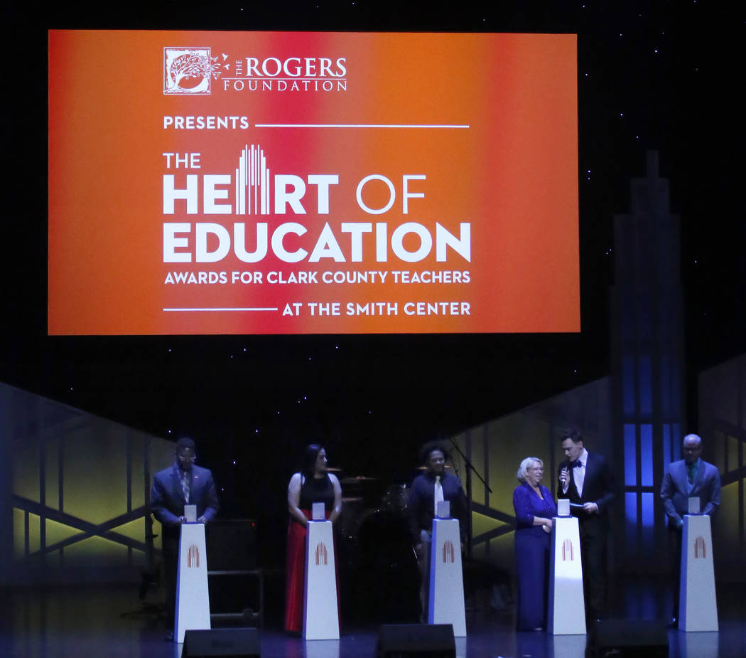 Erich Bergen presents an award to Whitney Elementary School teacher Kimberly Butterfield during the second annual Heart of Education awards at The Smith Center on Saturday, April 29, 2017, in Las  ...