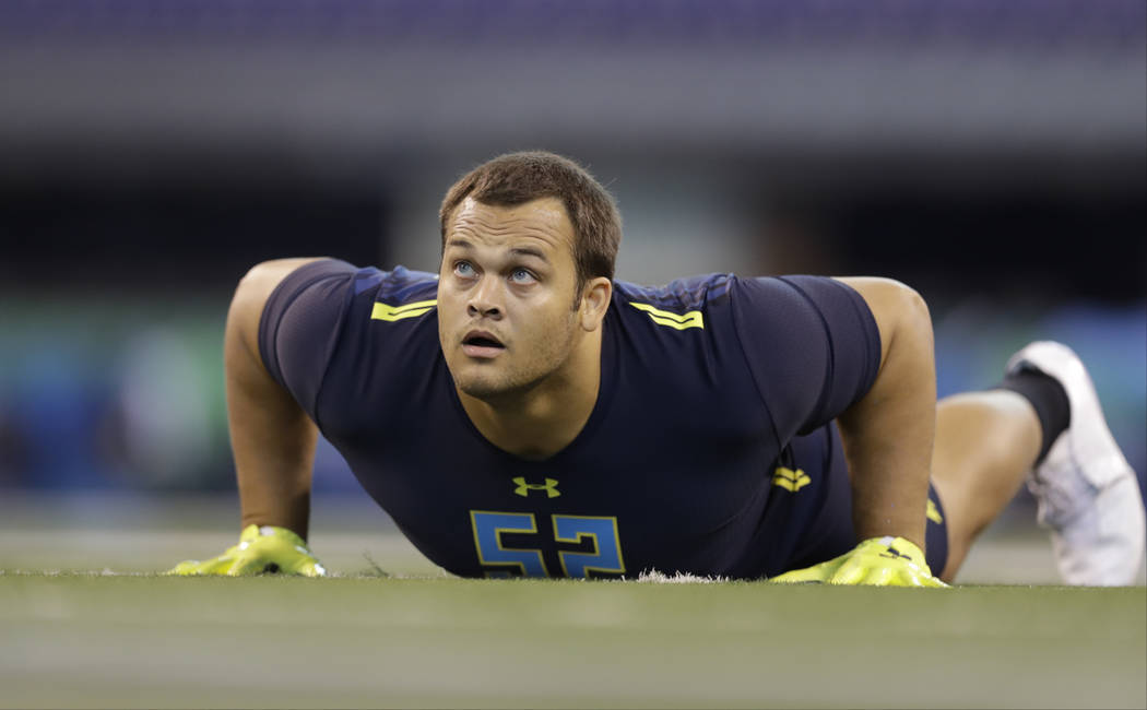 UCLA defensive lineman Eddie Vanderdoes runs a drill at the NFL football scouting combine Sunday, March 5, 2017, in Indianapolis. (AP Photo/David J. Phillip)