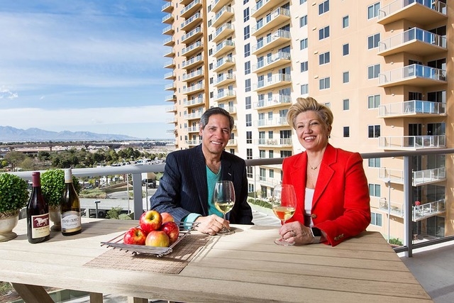 Paul and MaryAnn Fox enjoy the sweeping views from their balcony, where they make a toast to their new life and new home at One Las Vegas. (PROMOTIONAL/MONA SHIELD PAYNE )