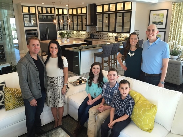 James Sullivan and Irena Hall pose in a Los Altos model by Toll Brothers. The couple showed off their new home to friends, Melissa and Jason Payan, who realized the spacious floor plan and large b ...