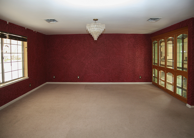 The Rancho Park home features a formal dining room dressed in deep red. ELKE COTE/RJREALESTATE.VEGAS