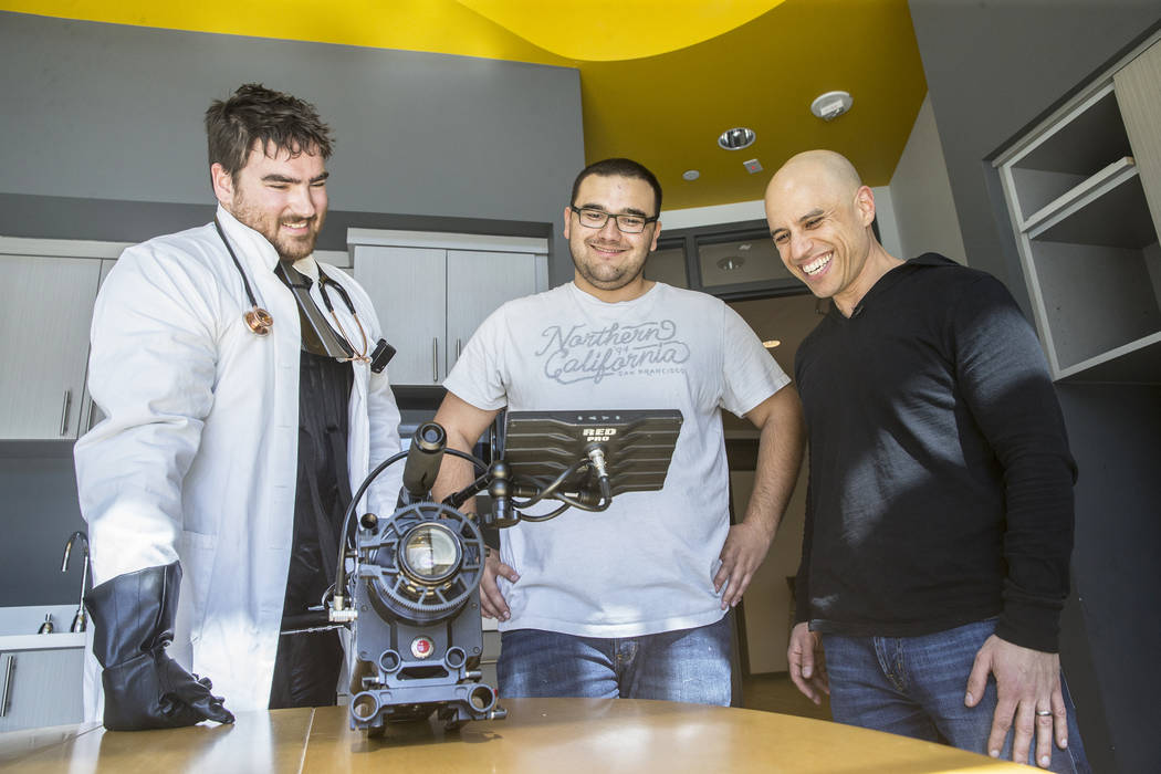 Director Tom Hinueber, left, cinematographer Logan Stewart and Dr. Zubin Damania, AKA "ZDoggMD," watch footage for an upcoming episode of "Doc Vader" at Turntable Health on Wednesday, March 8, 20 ...