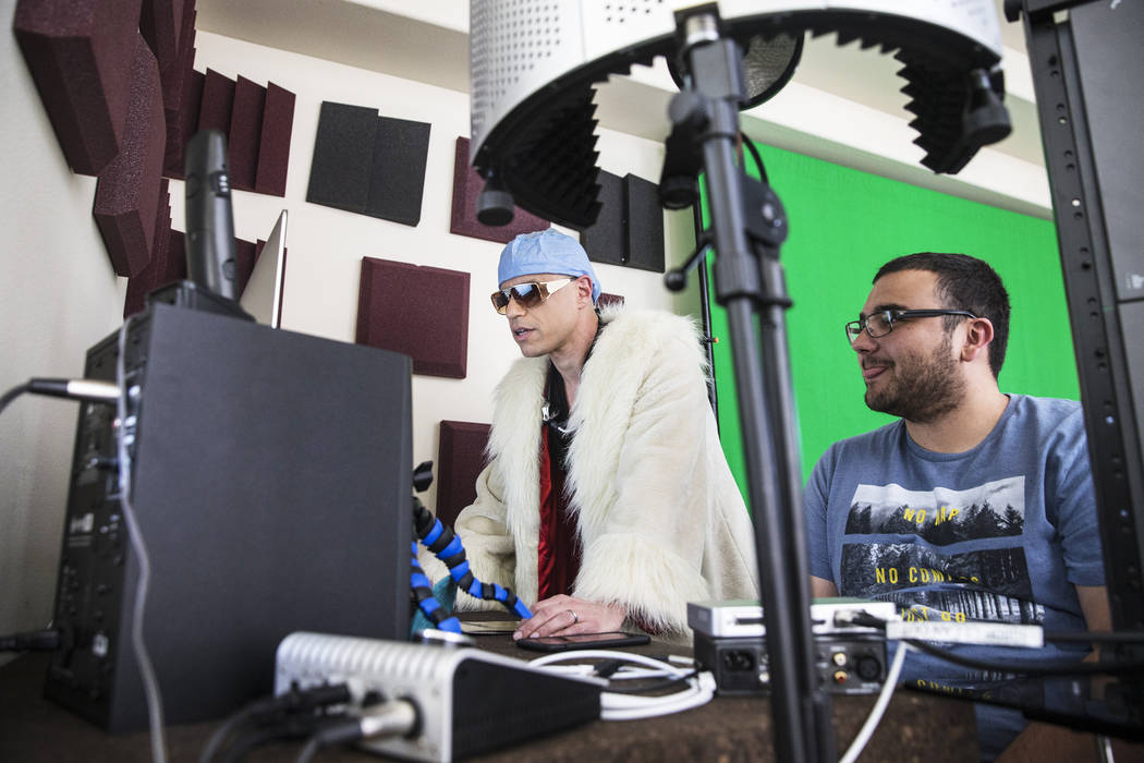 Dr. Zubin Damania, AKA "ZDoggMD," and Cinematographer Logan Stewart watch footage from Damania's Facebook Live medical advice show on Sunday, March 19, 2017, at his studio, in La ...