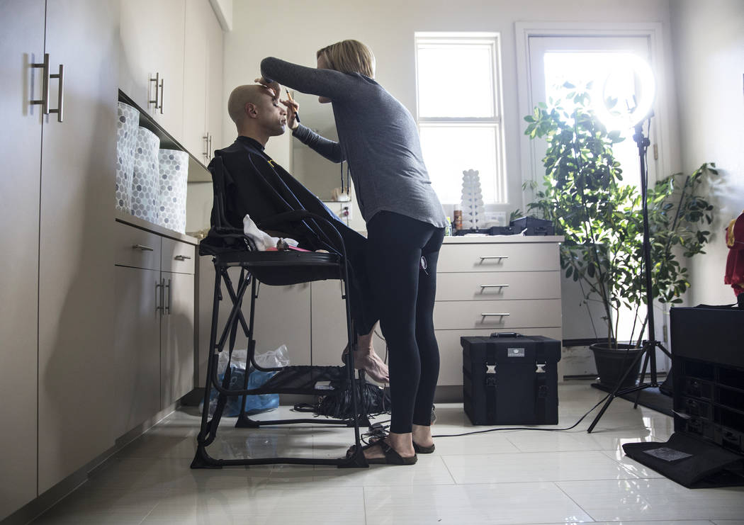 Dr. Zubin Damania, AKA &quot;ZDoggMD,&quot; left, gets his makeup done by Lindsey Dimick before filming a scene parodying Kesha's hit song 'Tik Tok' on Sunday, April 9, 2017, at Damania's  ...