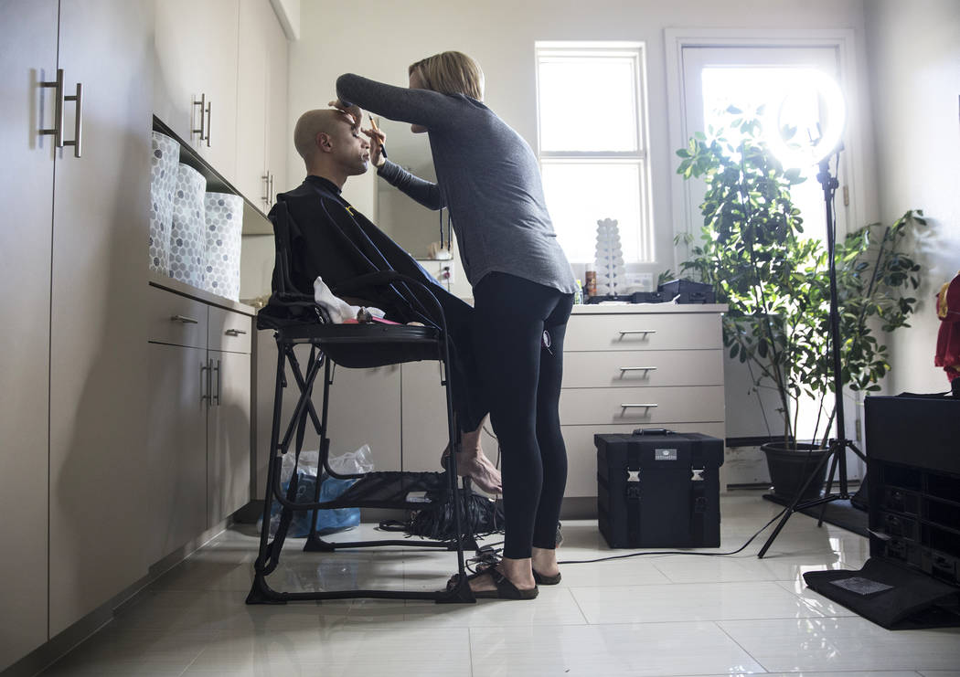 Dr. Zubin Damania, AKA "ZDoggMD," left, gets his makeup done by Lindsey Dimick before filming a scene parodying Kesha's hit song 'Tik Tok' on Sunday, April 9, 2017, at Damania's ...