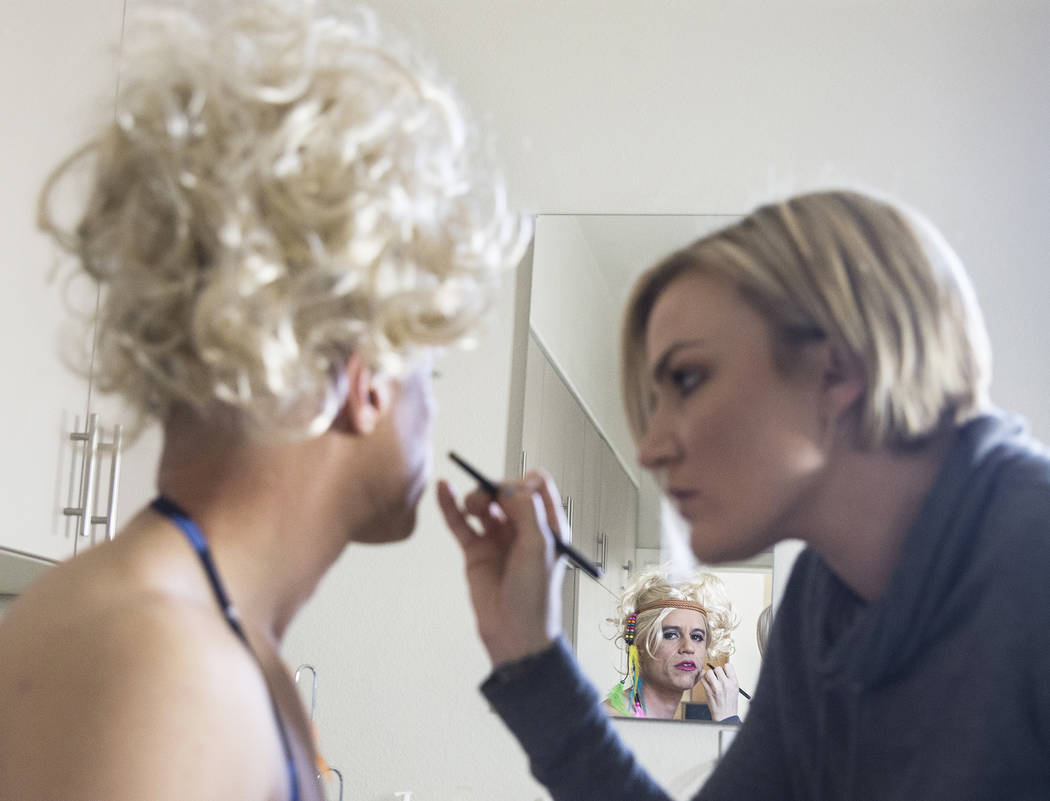 Dr. Zubin Damania, AKA "ZDoggMD," left, gets his makeup done by Lindsey Dimick before filming a scene parodying Kesha's hit song 'Tik Tok' on Sunday, April 9, 2017, at Damania's ...