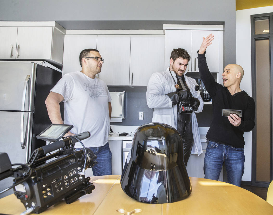 Cinematographer Logan Stewart, left, actor/director Tom Hinueber and Dr. Zubin Damania, AKA "ZDoggMD," walk through a scene for an upcoming episode of "Doc Vader" at Turntable Health on Wednesday, ...