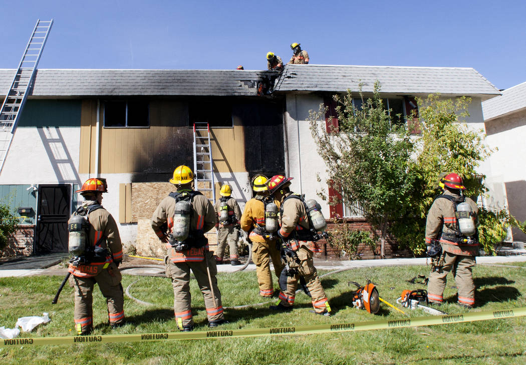 Clark County firefighters battle a fire at 741 and 743 Greenbriar Townhouse Way in Las Vegas on Wednesday, May 3, 2017. (Bizuayehu Tesfaye/Las Vegas Review-Journal) @bizutesfaye